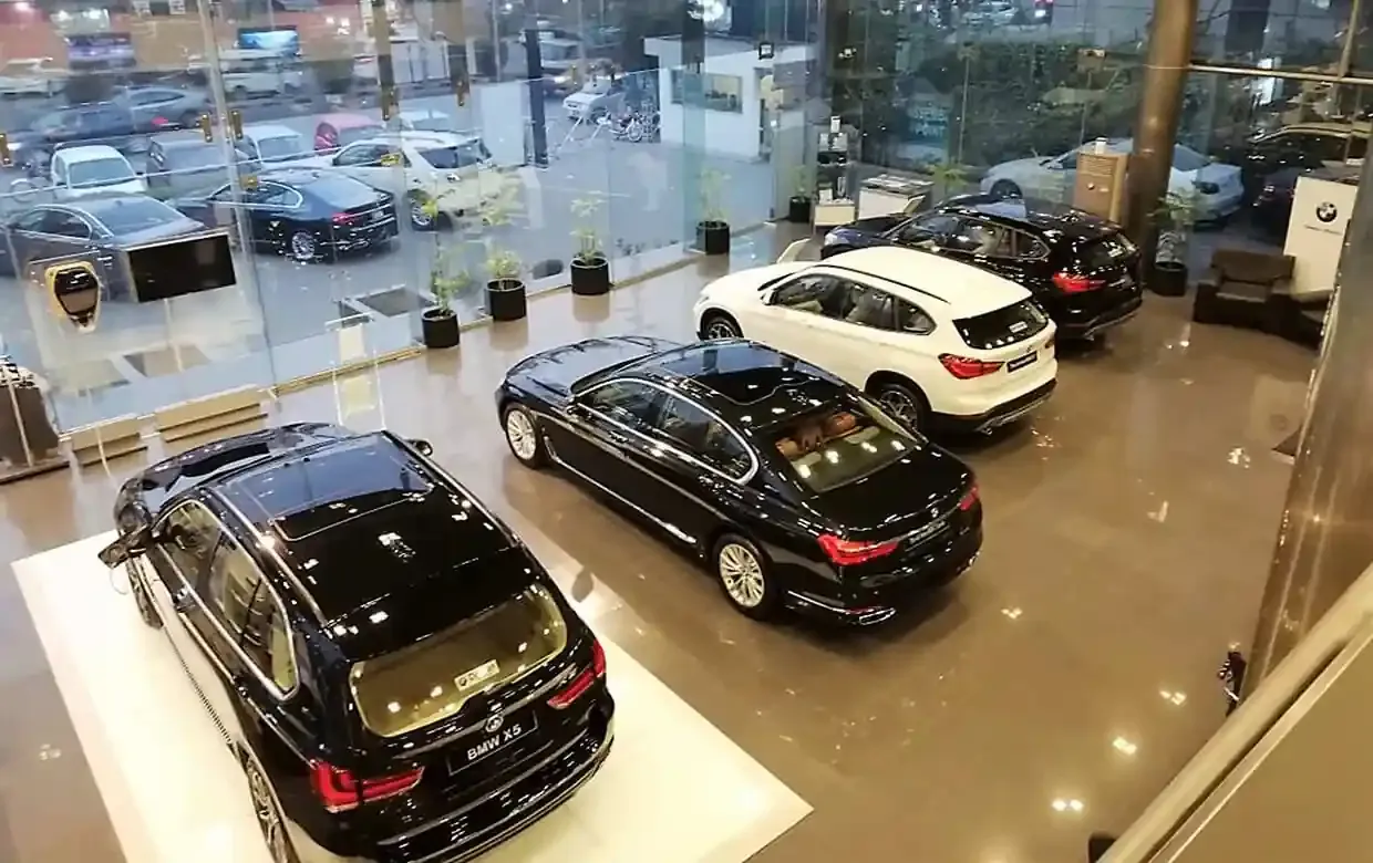 BMW showroom display floor in Lahore behind glass treated with 3M sun-control film