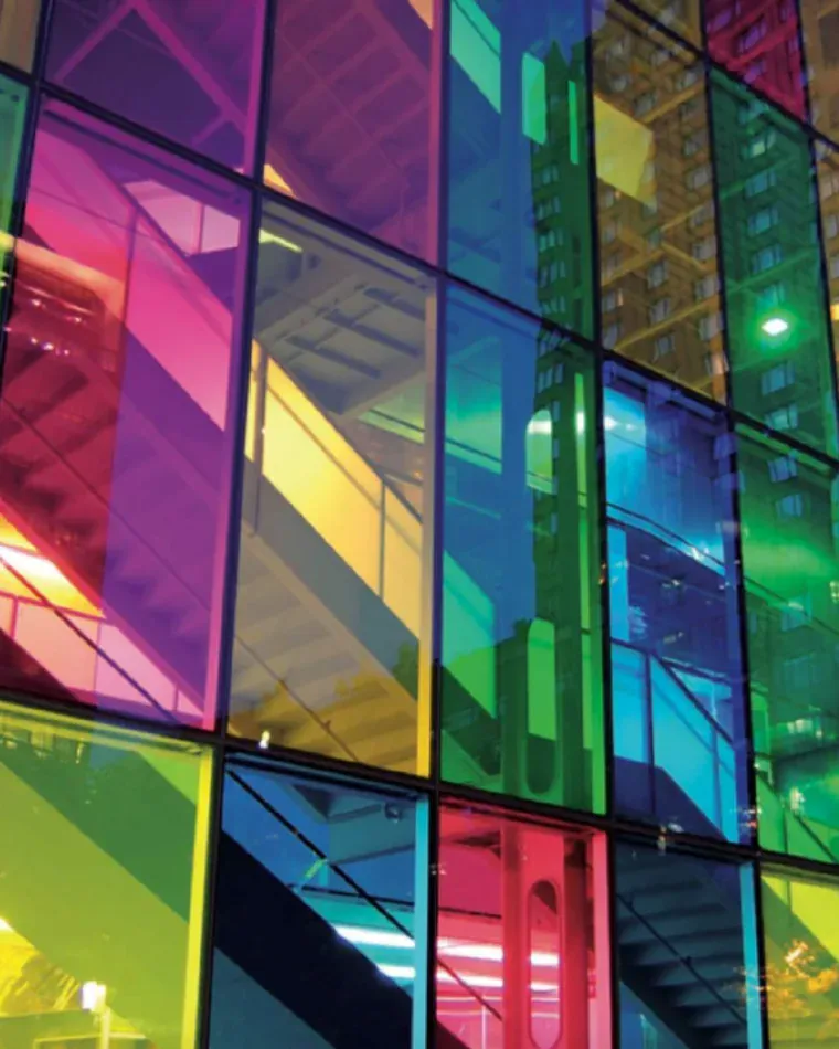 Coloured glass facade in transparent film tints