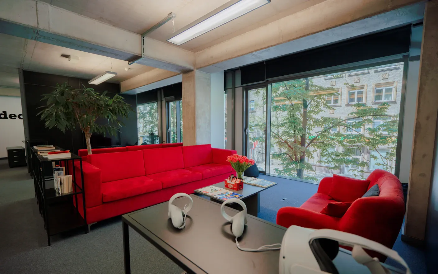 A home interior lit by daylight through tall windows