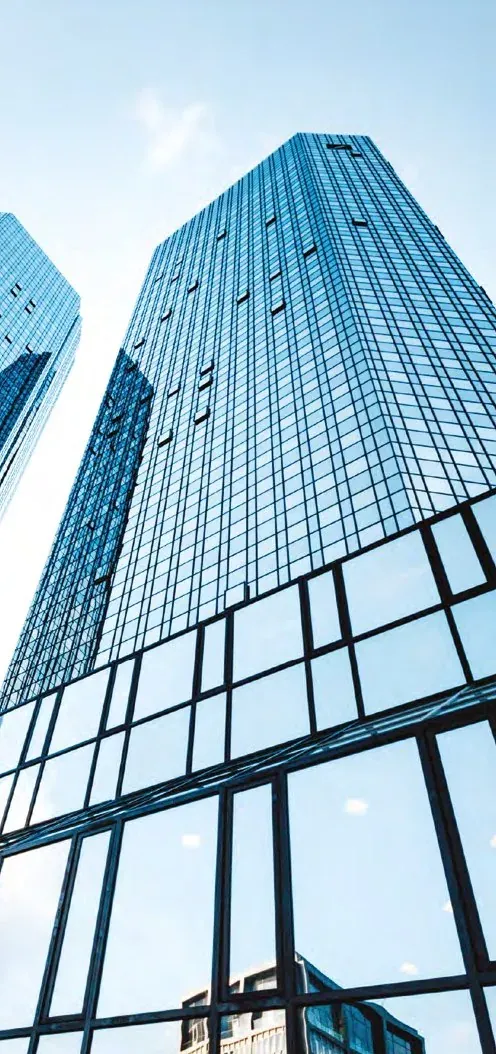 Mirrored glass towers seen from street level