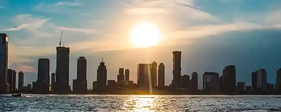 Glazed high-rise skyline of the kind Protek Devices films across Pakistan